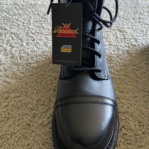 Thorogood, black boots that have never been worn with the tag still on them.
